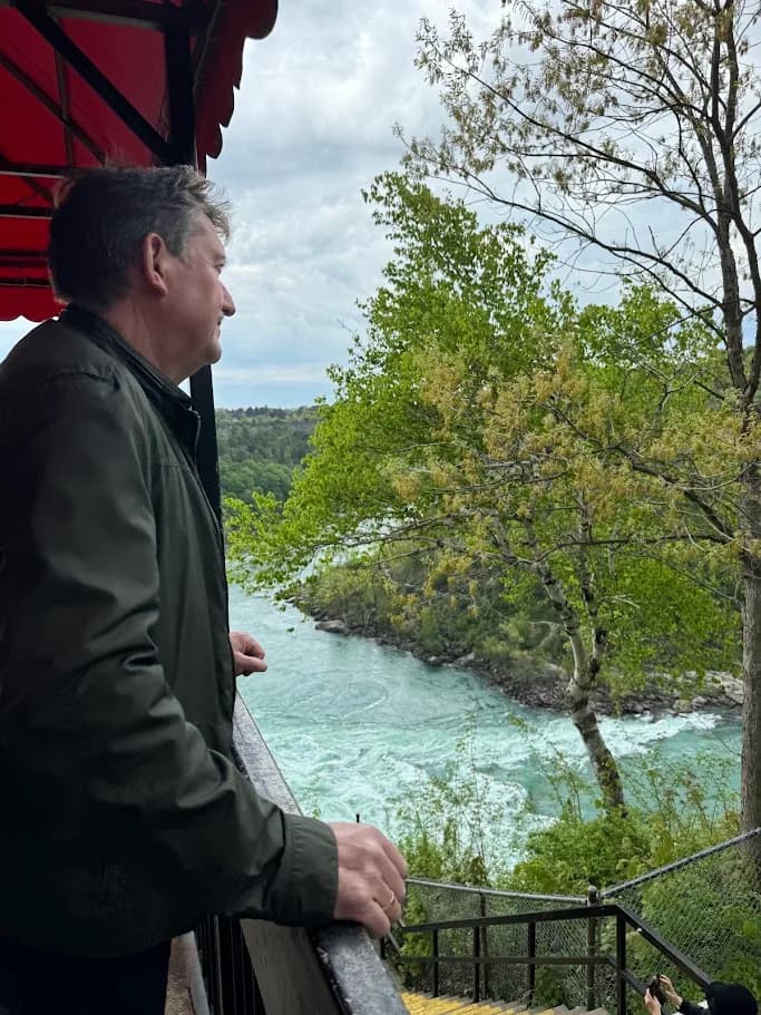 Guest looking across the Niagara Whirlpool from an elevated viewpoint